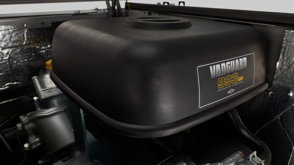 The engine compartment of a vehicle with a PowerProtect™ 26kW Standby Generator.