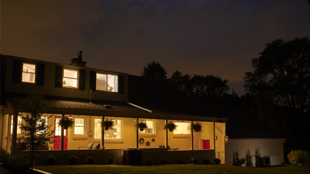 A large PowerProtect™ DX 20kW Standby Generator at night.