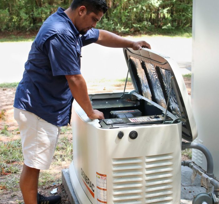 US Power Pros Electrician working on a Generac Generator